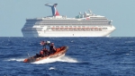 Круизный лайнера Carnival Triumph отбуксировали в порт